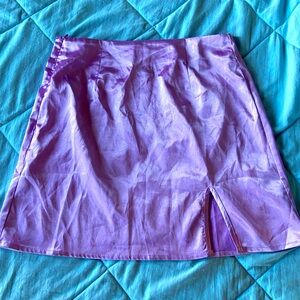 Purple satin mini skirt with slit